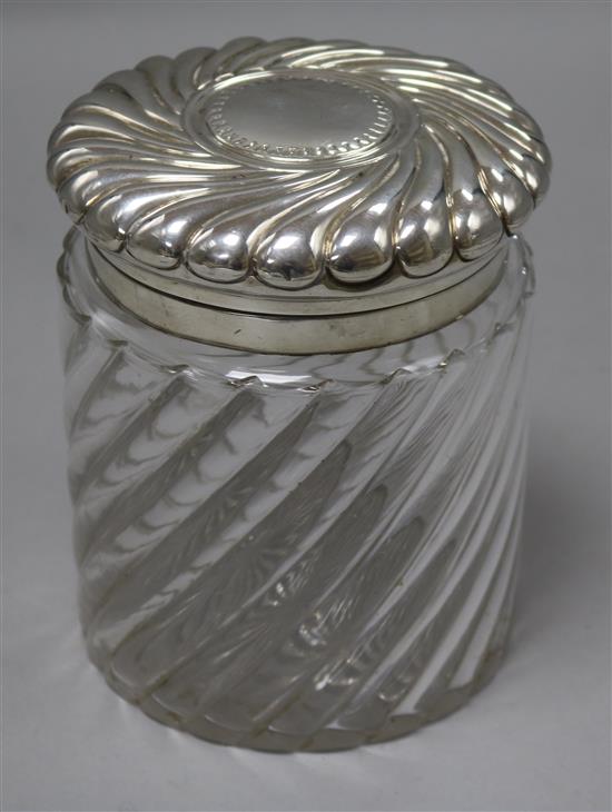 A late Victorian repousse silver mounted glass biscuit barrel, by John Grinsell & Sons, London, 1892, height 16cm.